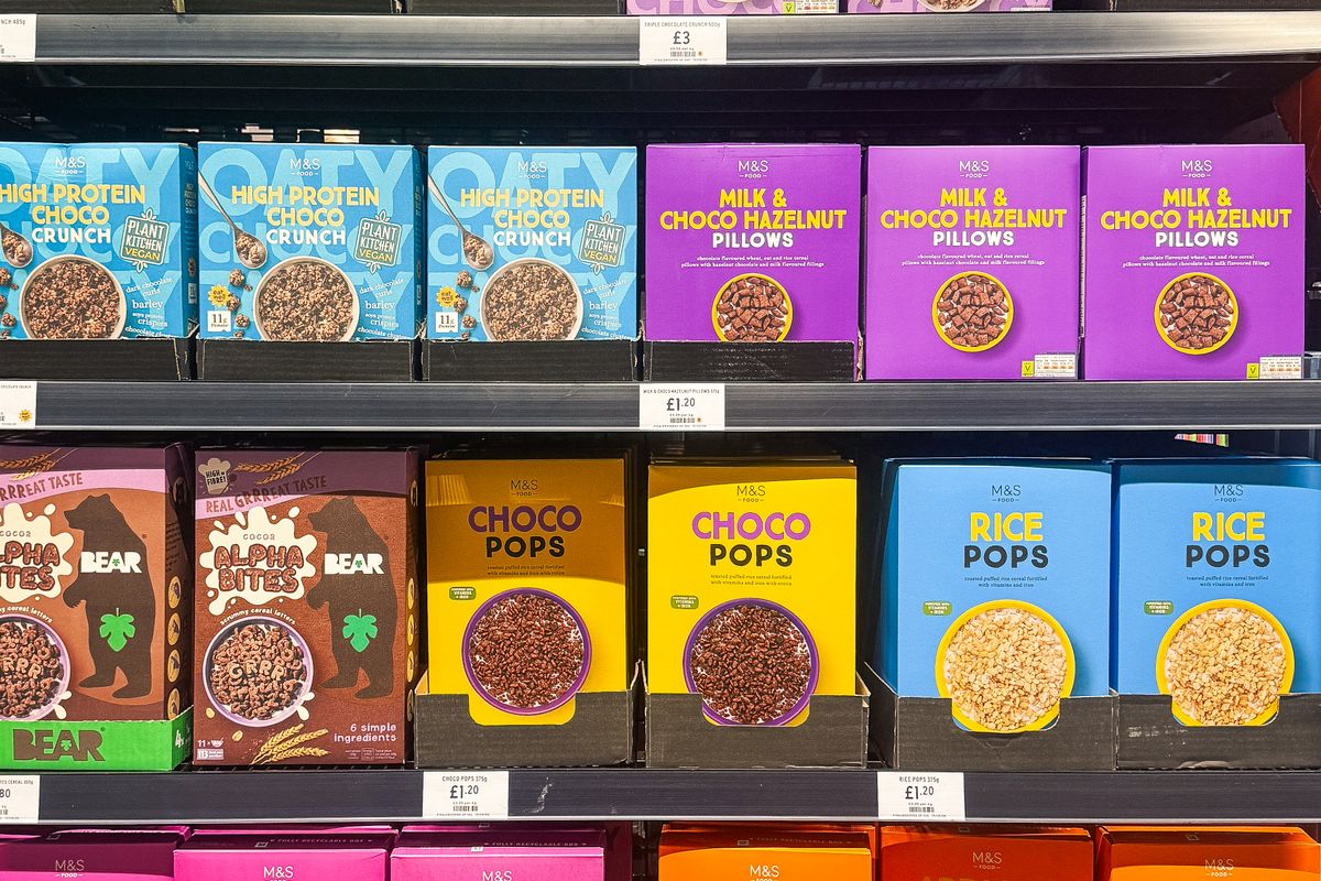 Well-stocked shelves of packaged groceries and cereals in the shop